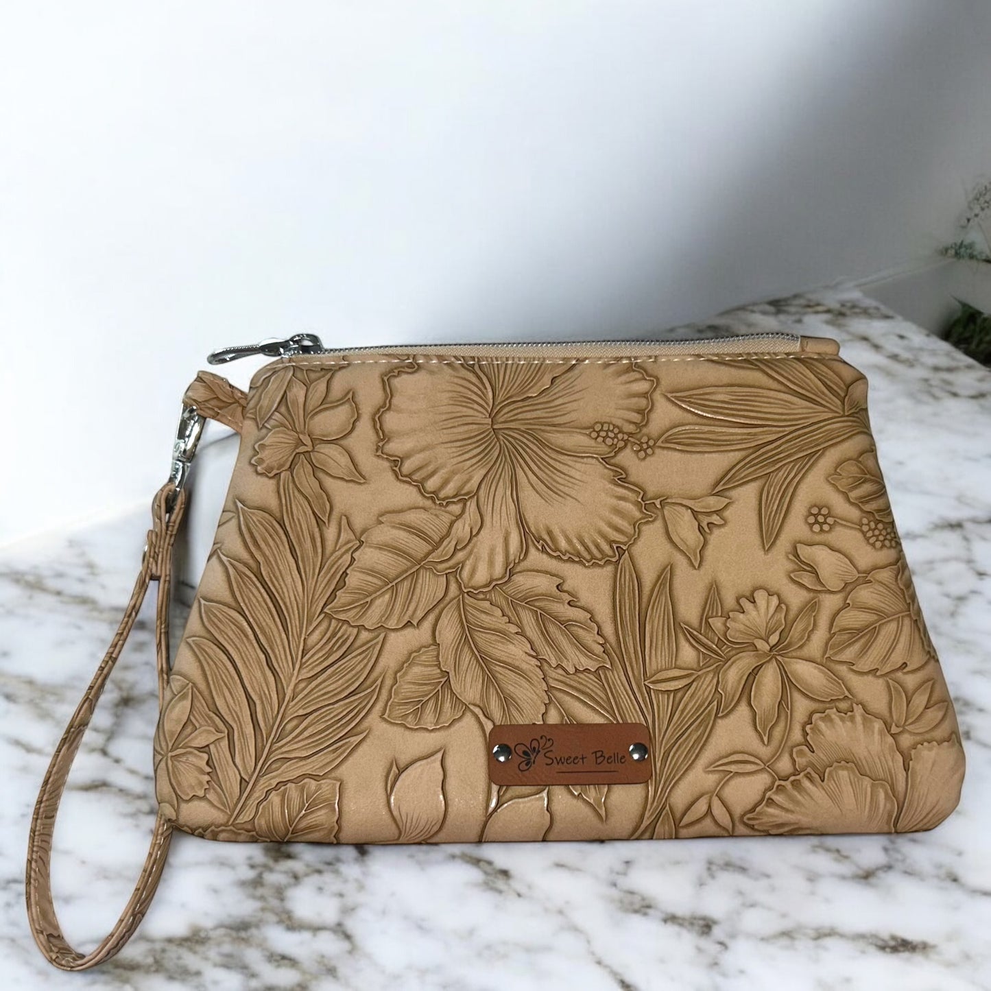 Sand Flower Embossed Curved Wristlet